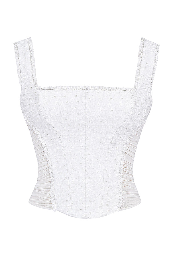 Corset en broderie anglaise blanche avec mini-jupe superposée