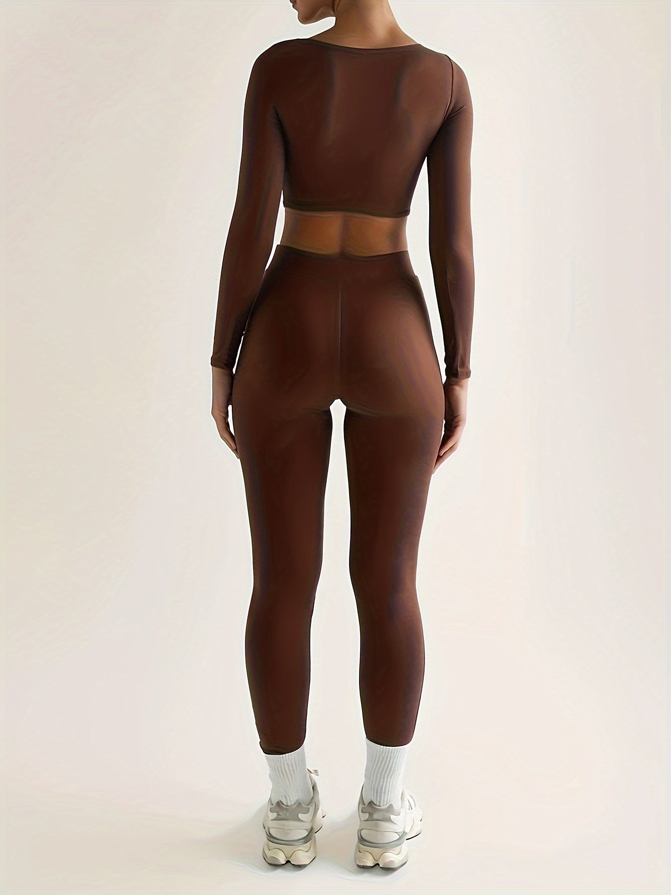 Ensemble de sport composé d'un crop top à manches longues et d'un pantalon skinny taille haute
