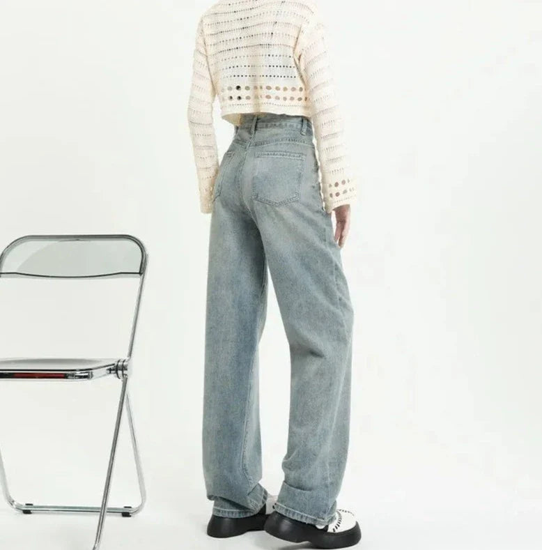 Jean taille haute avec poches déchirées