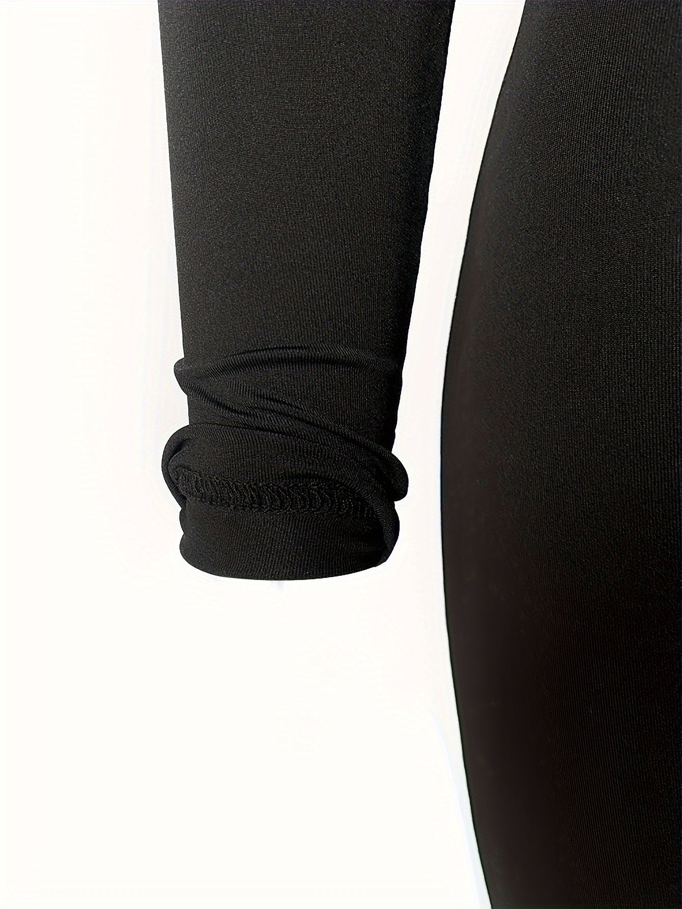 Ensemble de sport composé d'un crop top à manches longues et d'un pantalon skinny taille haute
