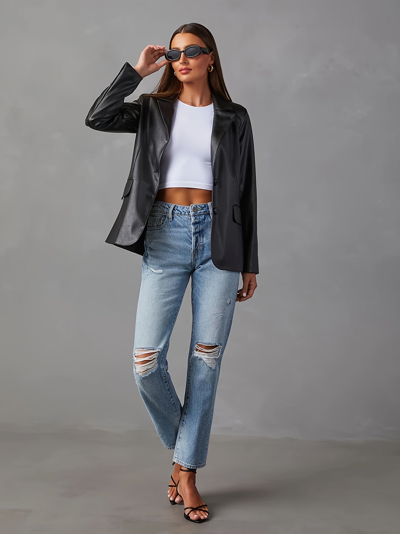 Veste en cuir noir avec bouton