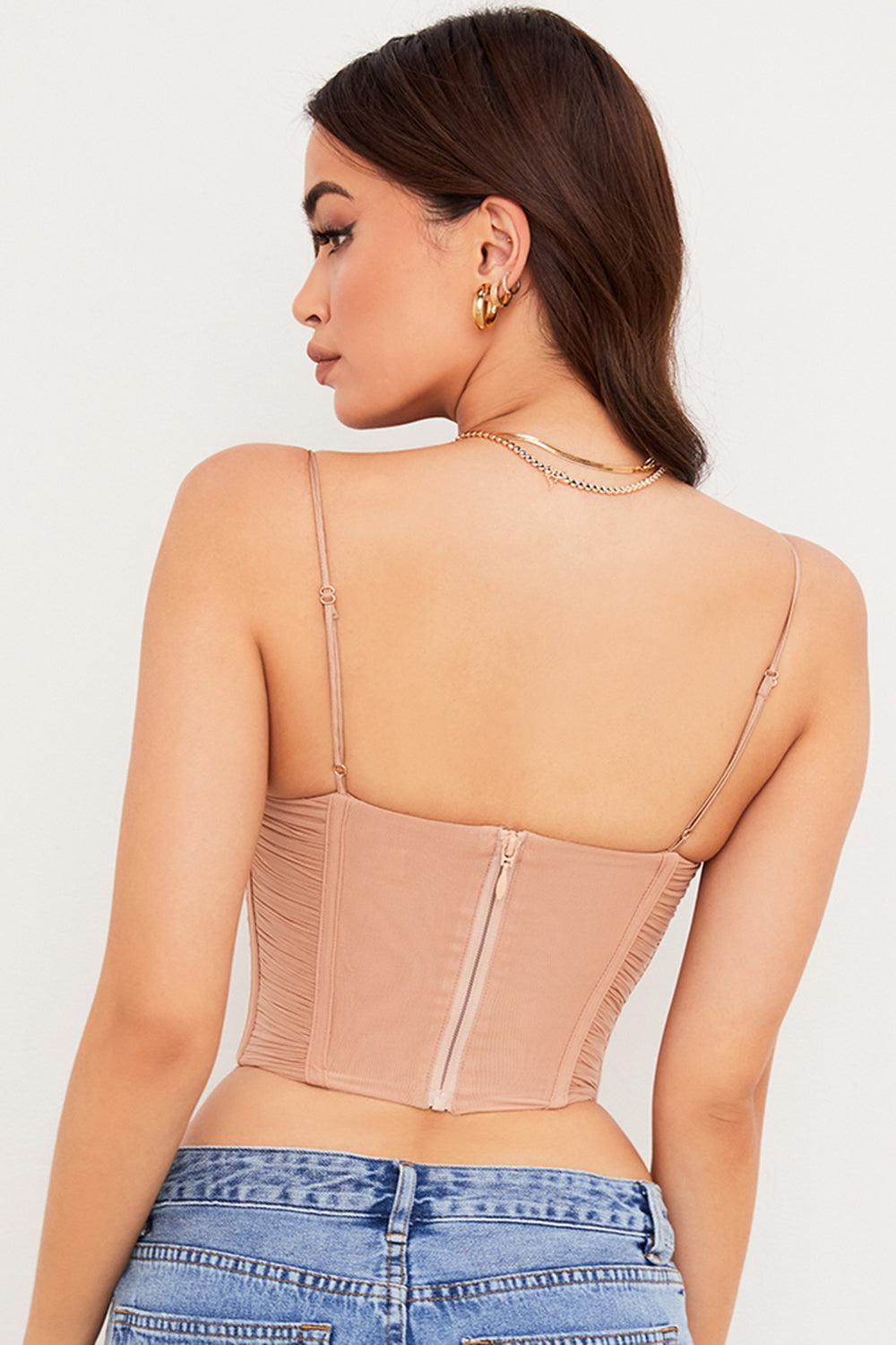 Corset drapé en résille beige