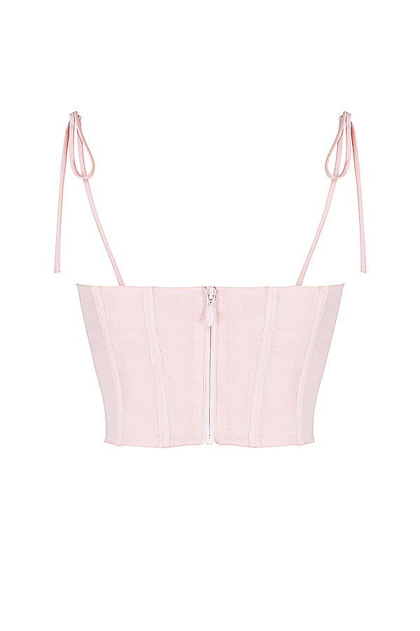 Corset court rose bébé avec buste en mousseline plissée