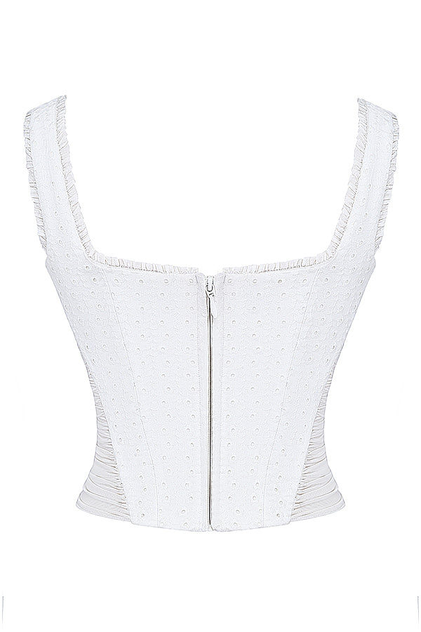 Corset en broderie anglaise blanche avec mini-jupe superposée