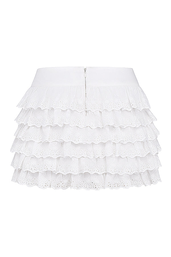 Corset en broderie anglaise blanche avec mini-jupe superposée