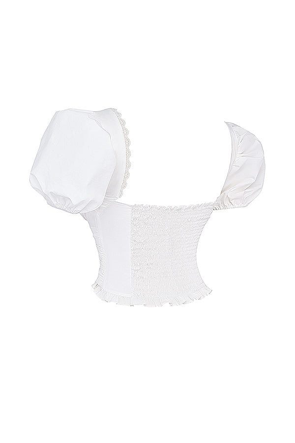 Haut plissé blanc avec mini-jupe portefeuille plissée Stone