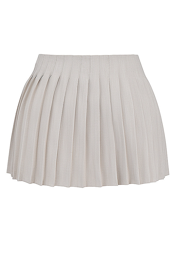 Haut plissé blanc avec mini-jupe portefeuille plissée Stone