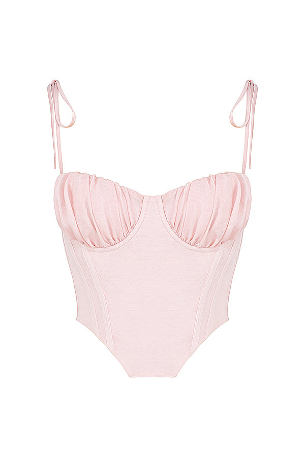 Corset court rose bébé avec buste en mousseline plissée