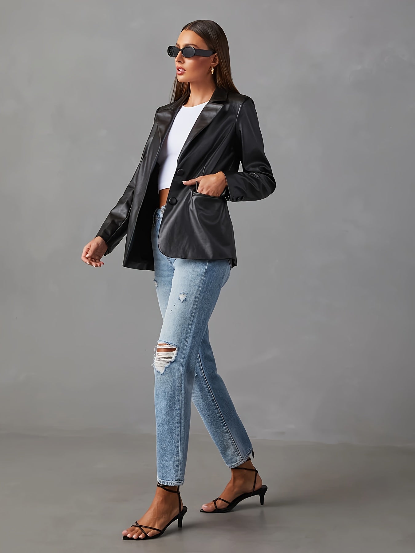 Veste en cuir noir avec bouton