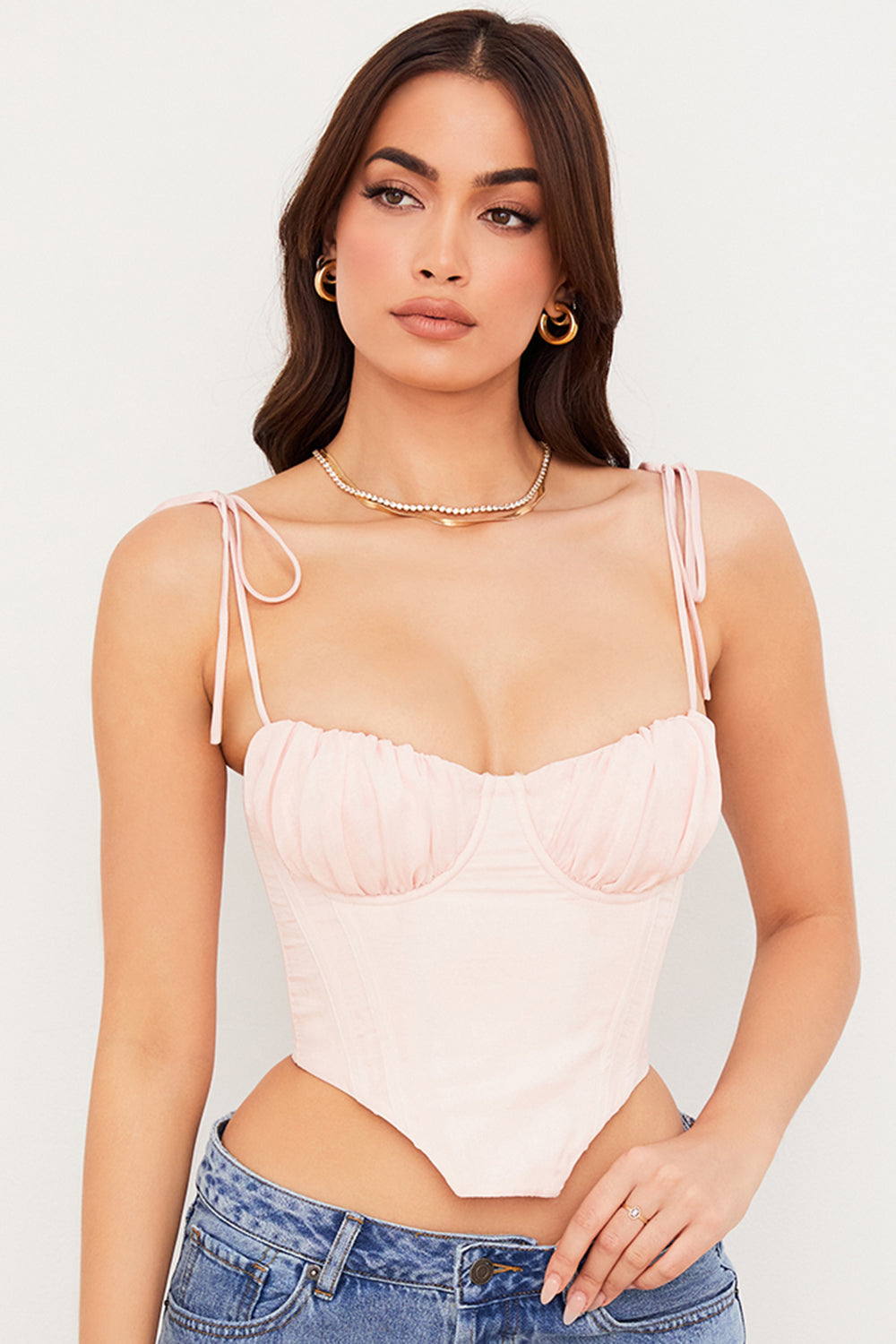 Corset court rose bébé avec buste en mousseline plissée