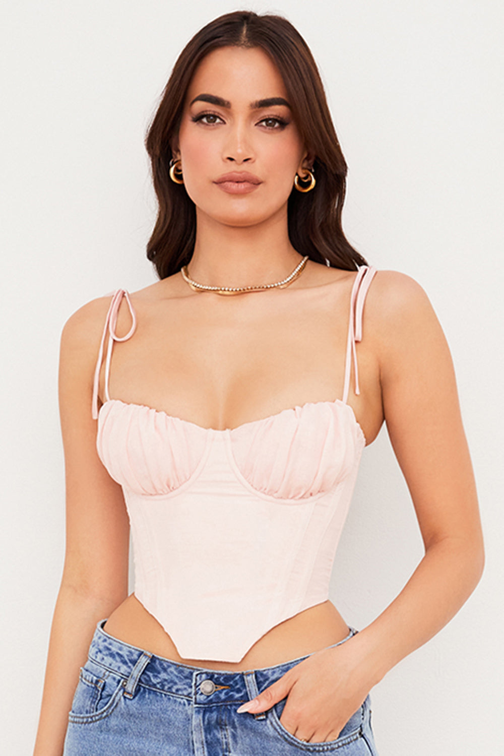 Corset court rose bébé avec buste en mousseline plissée