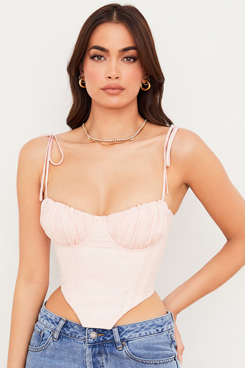 Corset court rose bébé avec buste en mousseline plissée